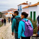 환경이주민 문제의 윤리적 측면 - A diverse group of environmental migrants arriving in a small Portuguese coastal village, wearing mo...